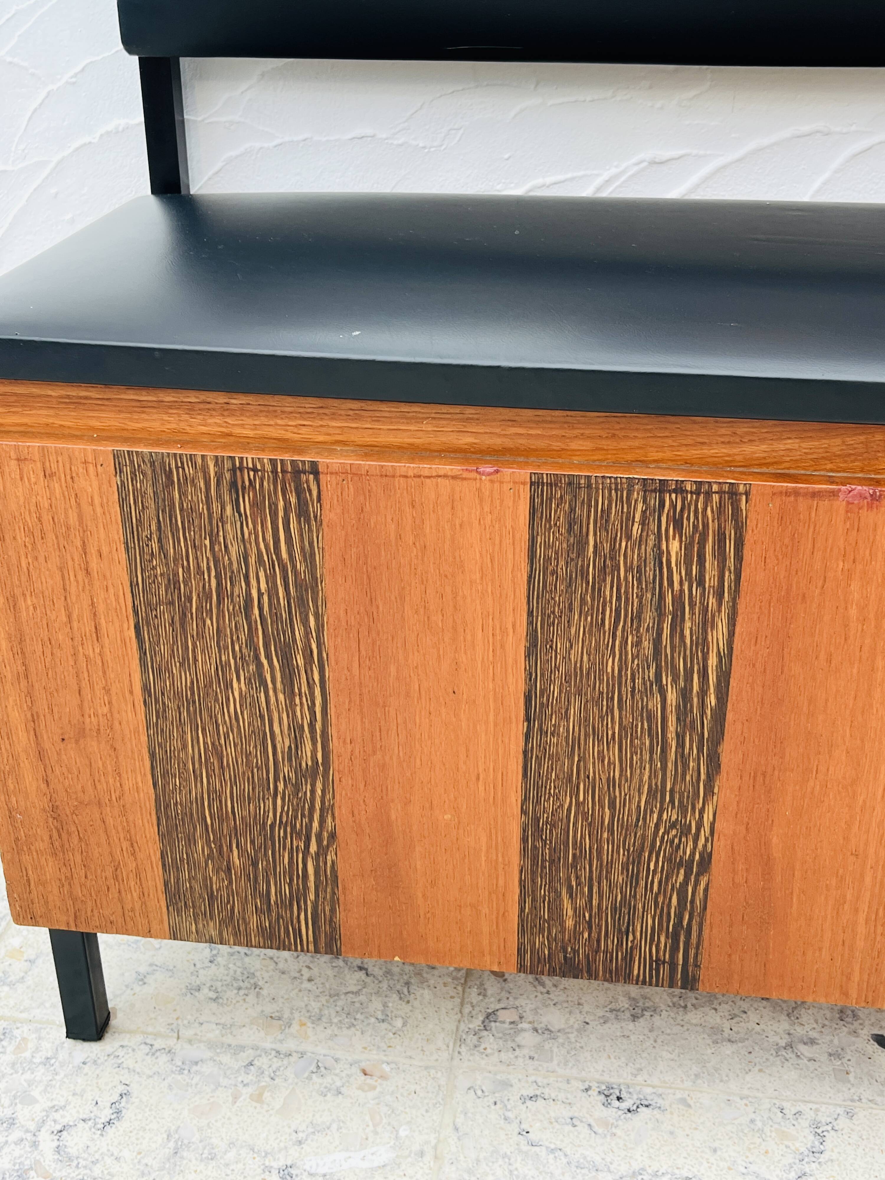 Vintage wall coat rack with storage bench from the 1970s.