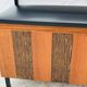 Vintage wall coat rack with storage bench from the 1970s.