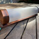 Bauhaus satin glass tube wall light from around 1930.