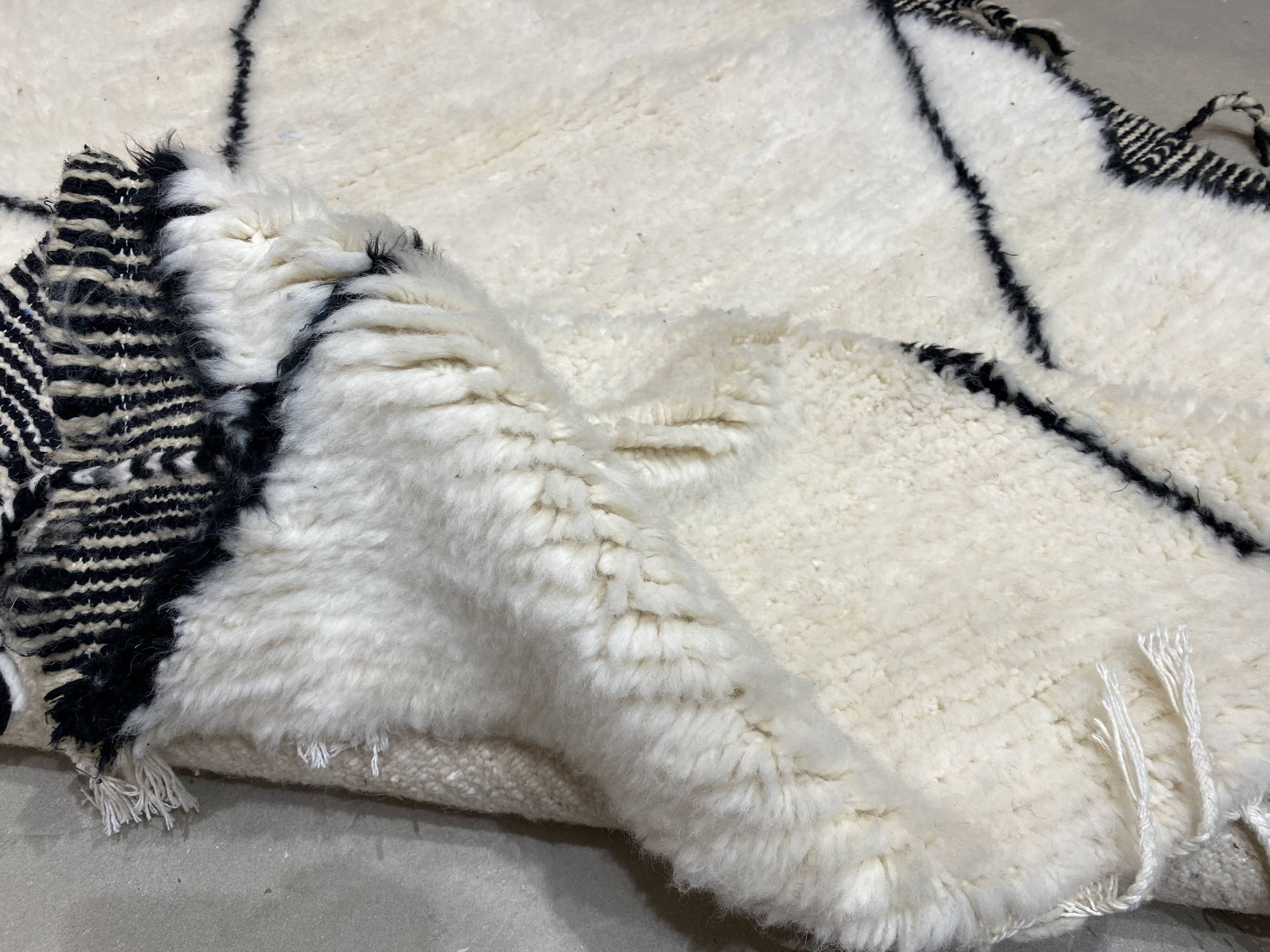 White wool rug with framing