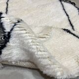 White wool rug with framing