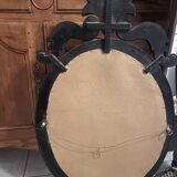 Oval Venetian mirror with close-bezel, early 20th century, flower decoration