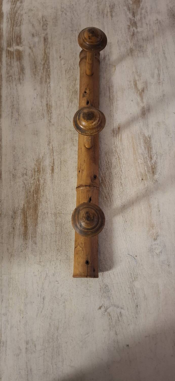 Turned wooden coat rack.