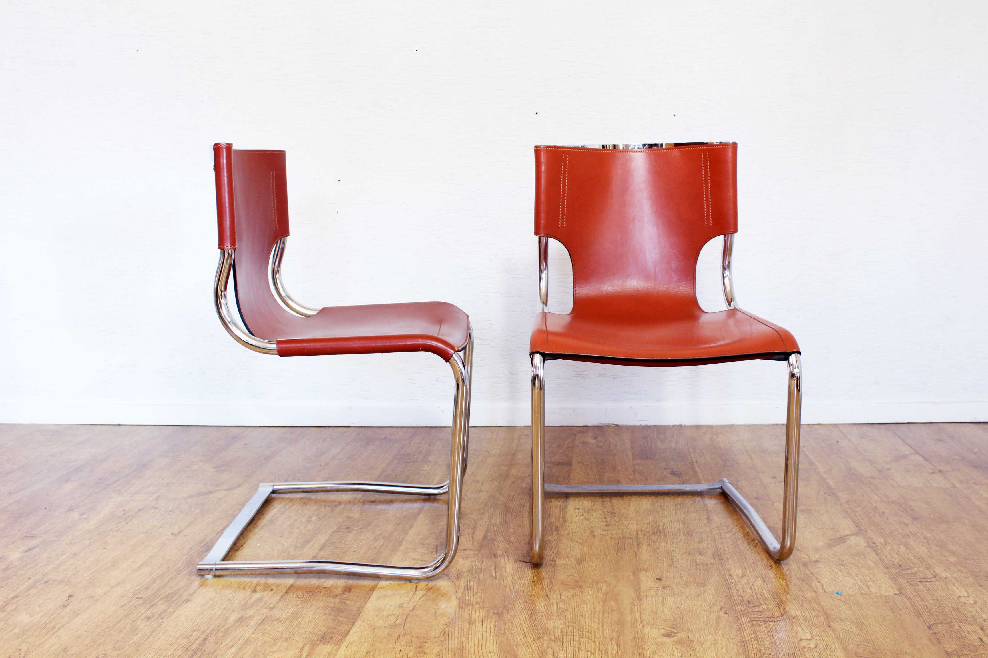 Pair of chairs in leather and chrome tube