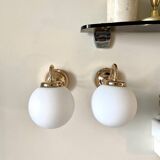 2 wall lamps in gilded metal and white opaline