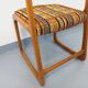 Vintage sled chair by Baumann in wood and wool fabric.