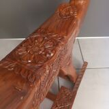 Decorative rocking elephant in carved exotic wood.