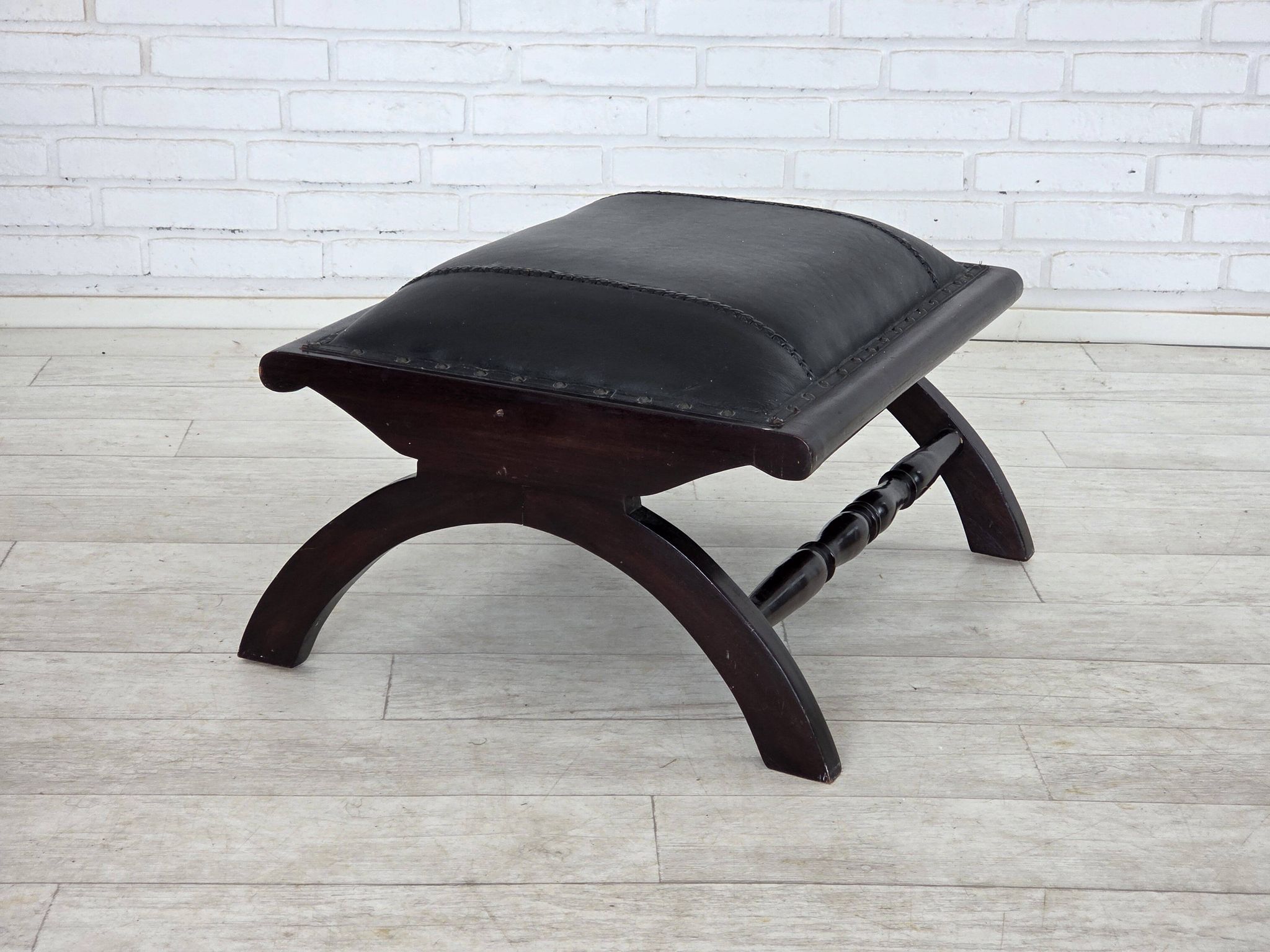 1970s, vintage armchair with footstool, black furniture leather.