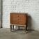 Small vintage Art Deco piece with 3 drawers, curved legs and caps.