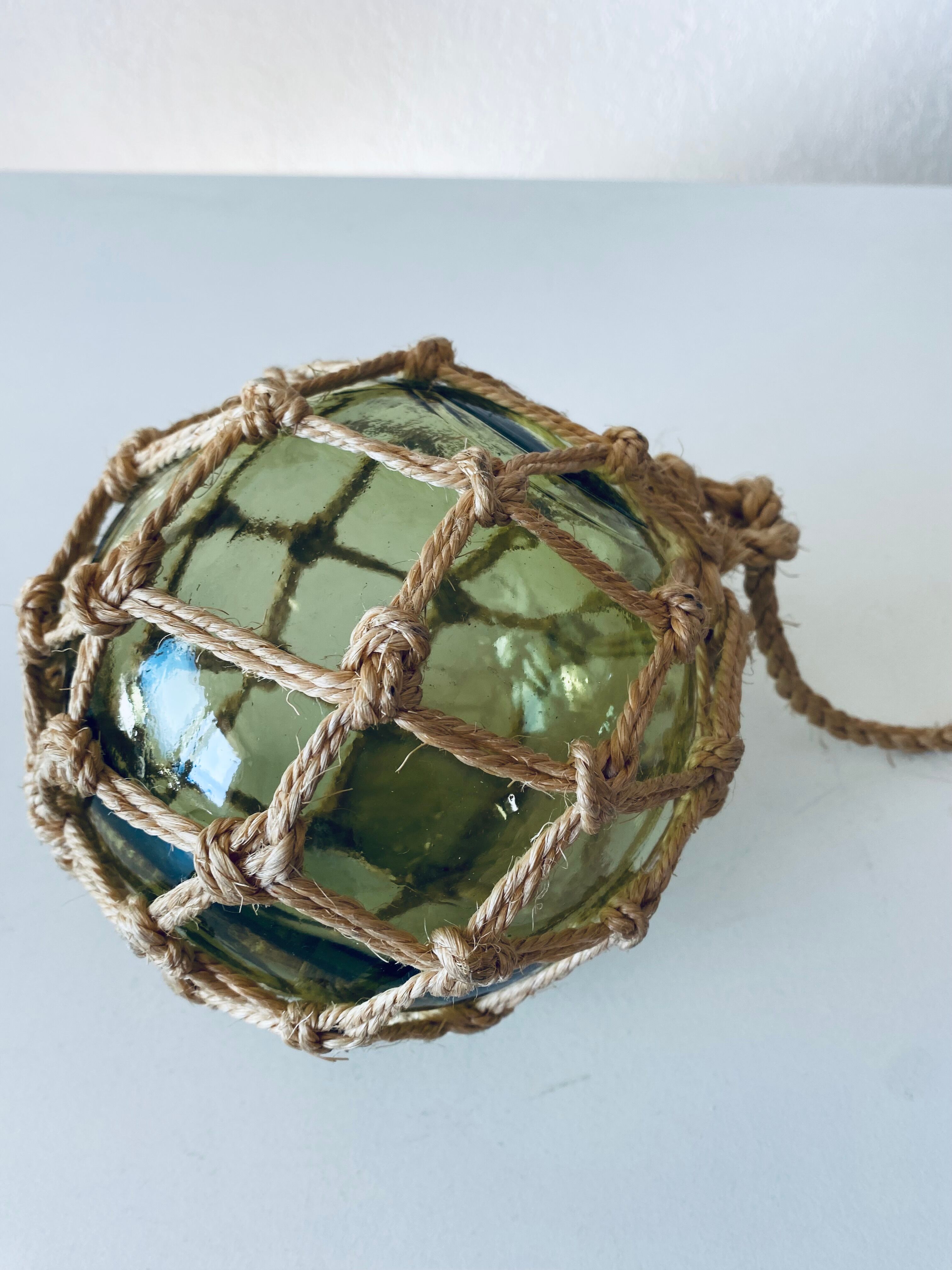 Antique fisherman's ball, old fishing floats