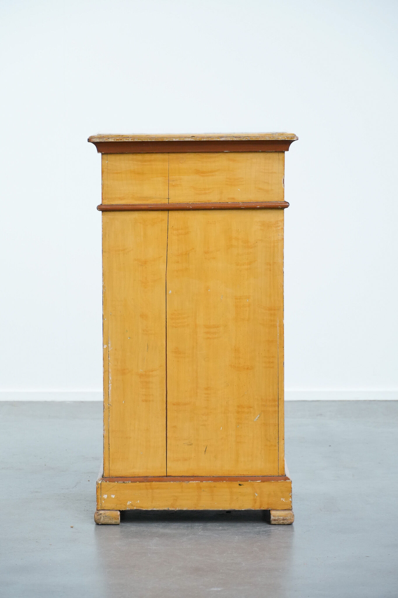 Antique wooden 1-door hallway/nightstand with a light marble top