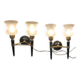 Pair of two-light torchiere wall lights in black lacquered metal and gilded brass, Circa 1960.