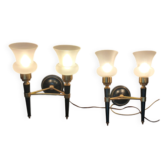 Pair of two-light torchiere wall lights in black lacquered metal and gilded brass, Circa 1960.