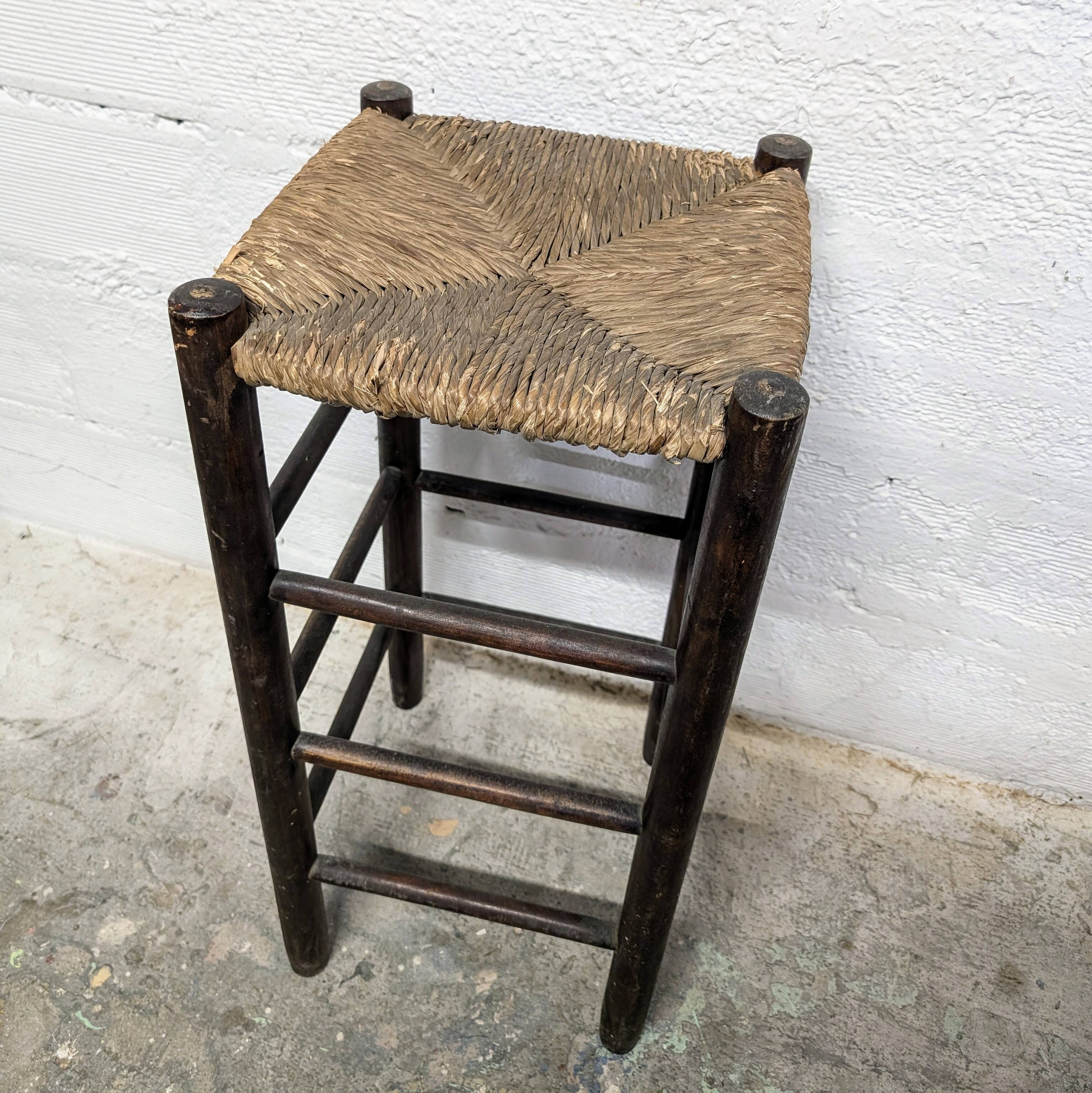 High stool made of wood and straw