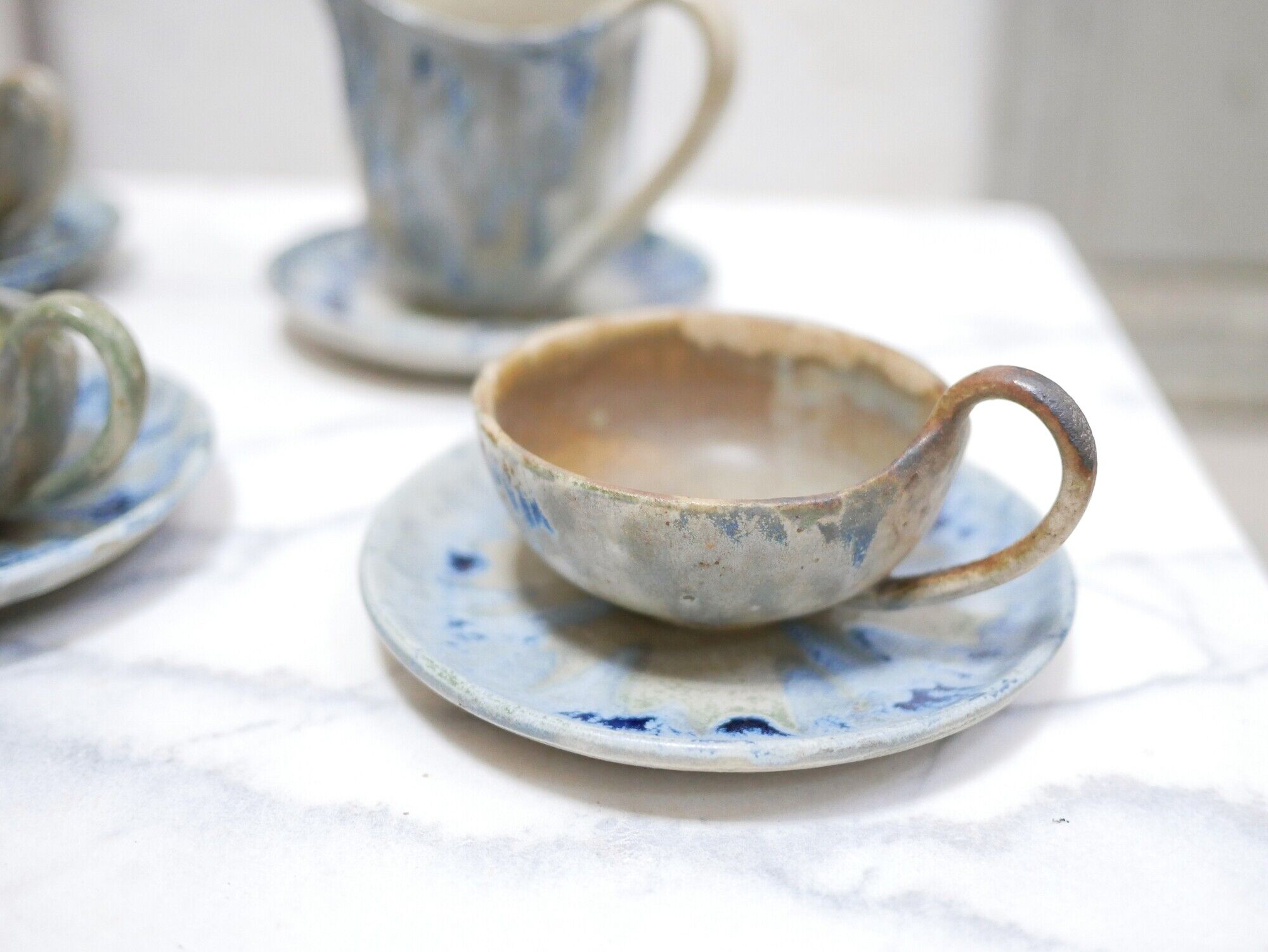 Series of 3 cups, a milk jar and 4 antique porcelain saucers