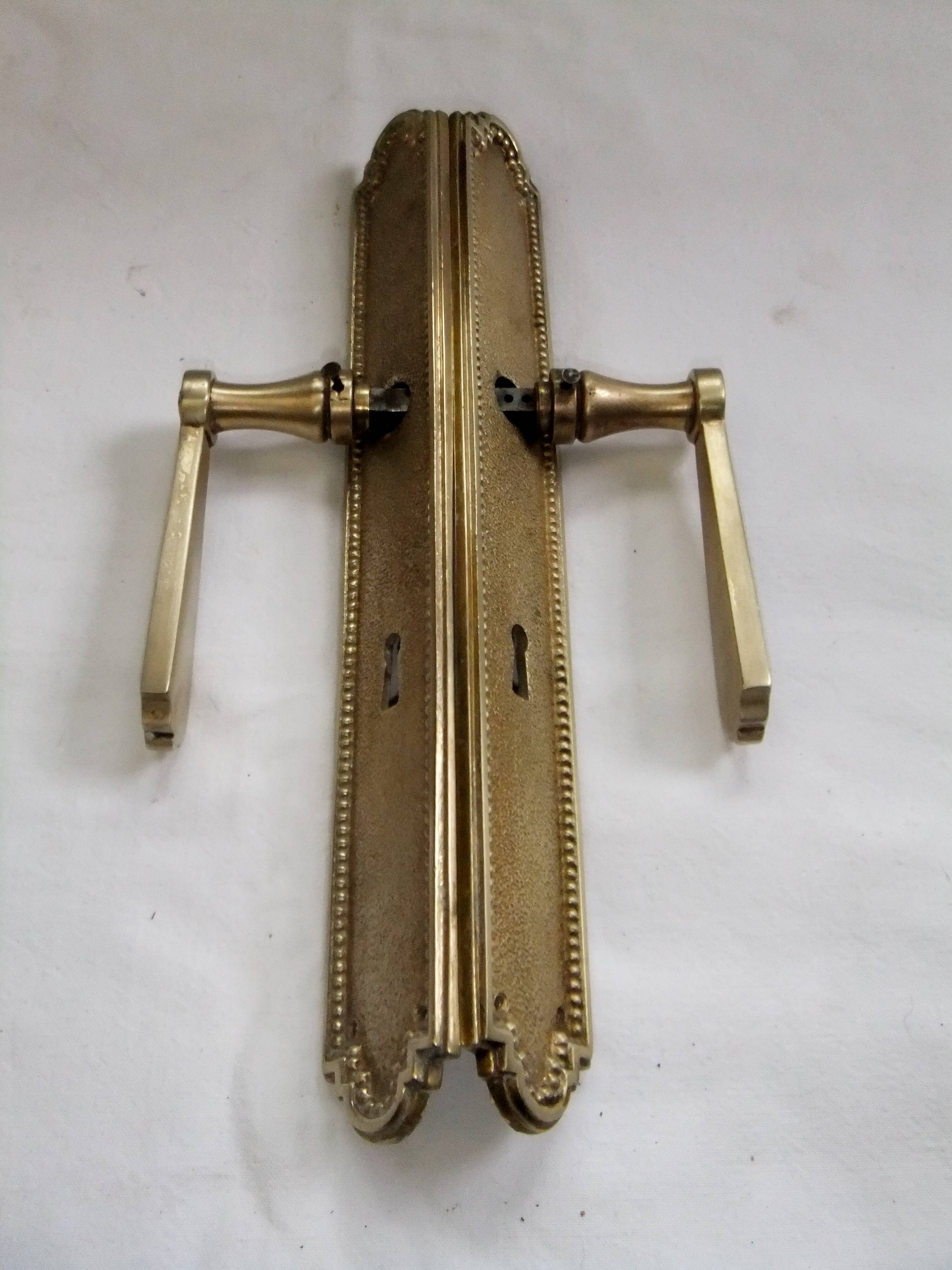 Pair of Louis XVI style beaded bronze door handles