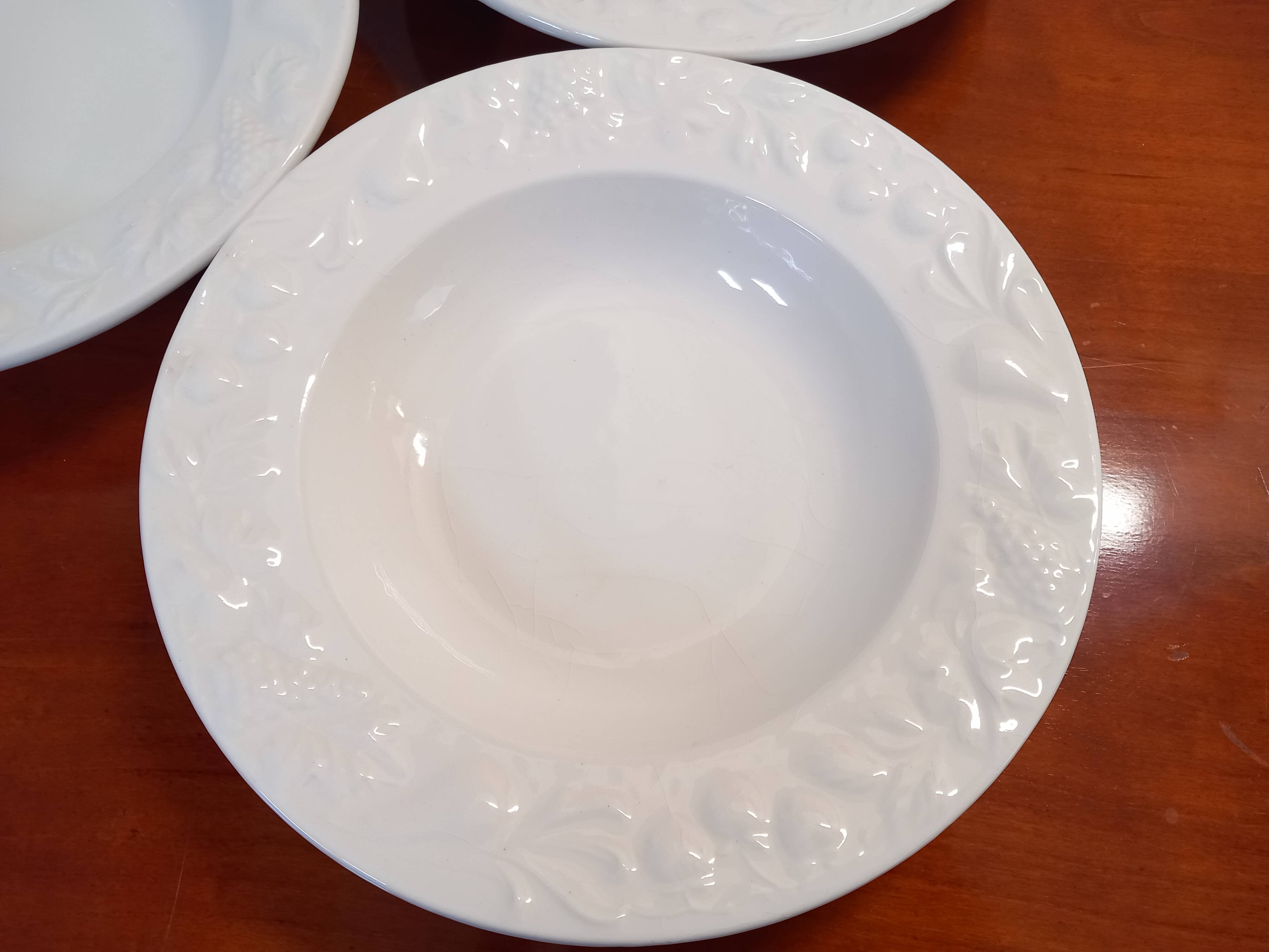 Set of 6 white ceramic deep plates made in Italy.