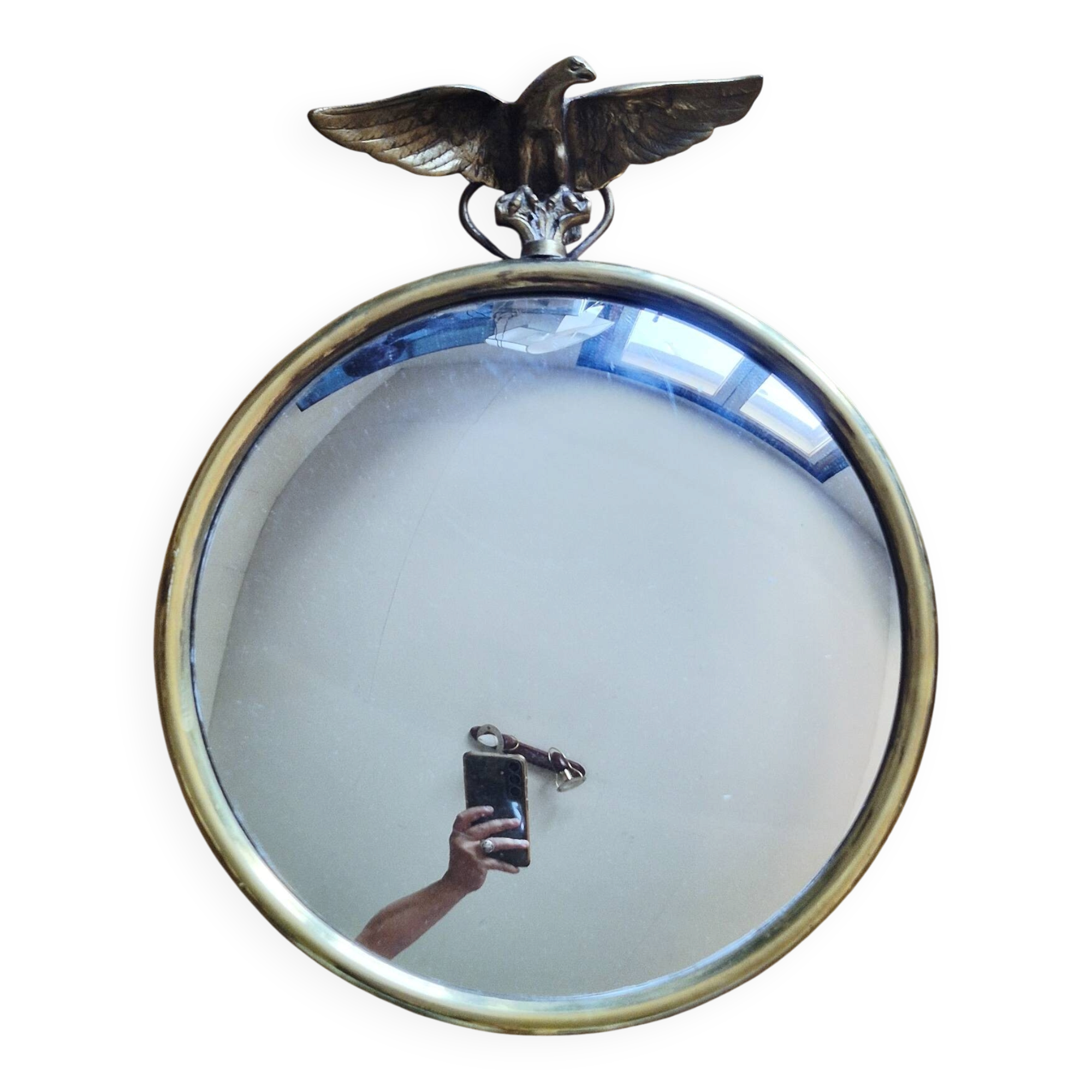Vintage convex witch mirror with triumphant eagle.
