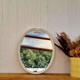 Vintage enamelled metal oval mirror