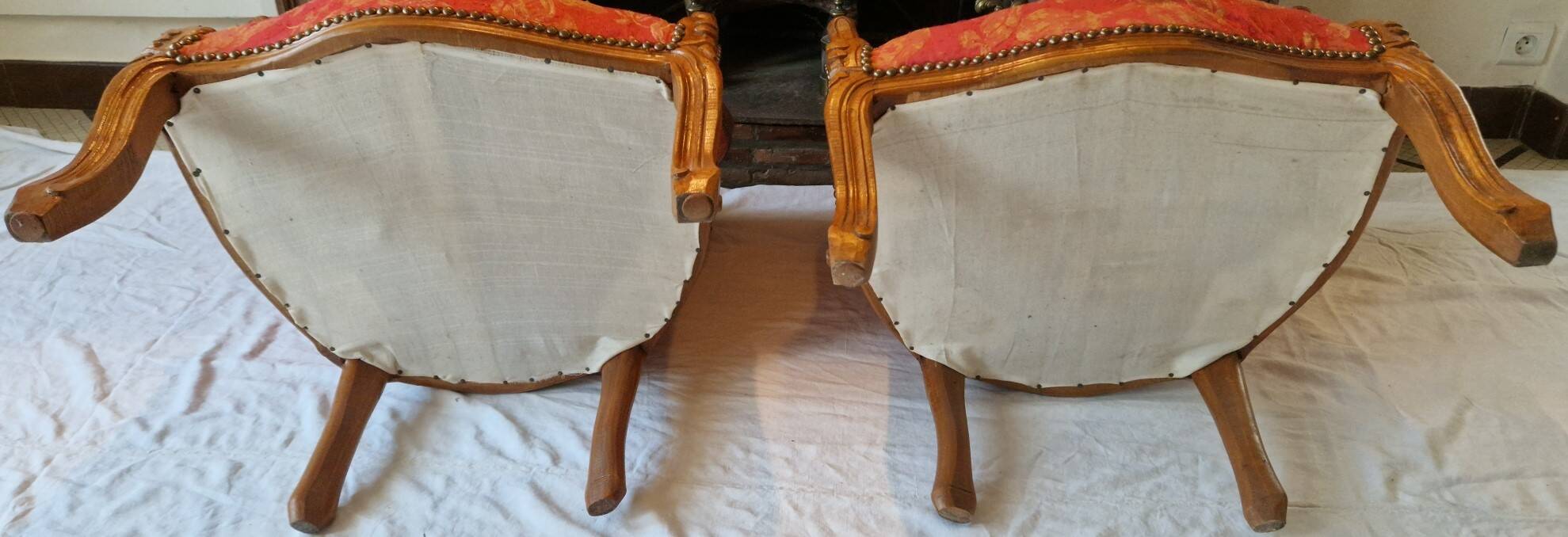 Pair of louis xv cabriolet armchairs with sculpted wood and pink & red floral fabric