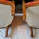 Pair of louis xv cabriolet armchairs with sculpted wood and pink & red floral fabric