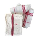 Two mismatched former dishcloths in red and white.