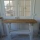 Vintage workbench with pearl gray patinated base and wooden top