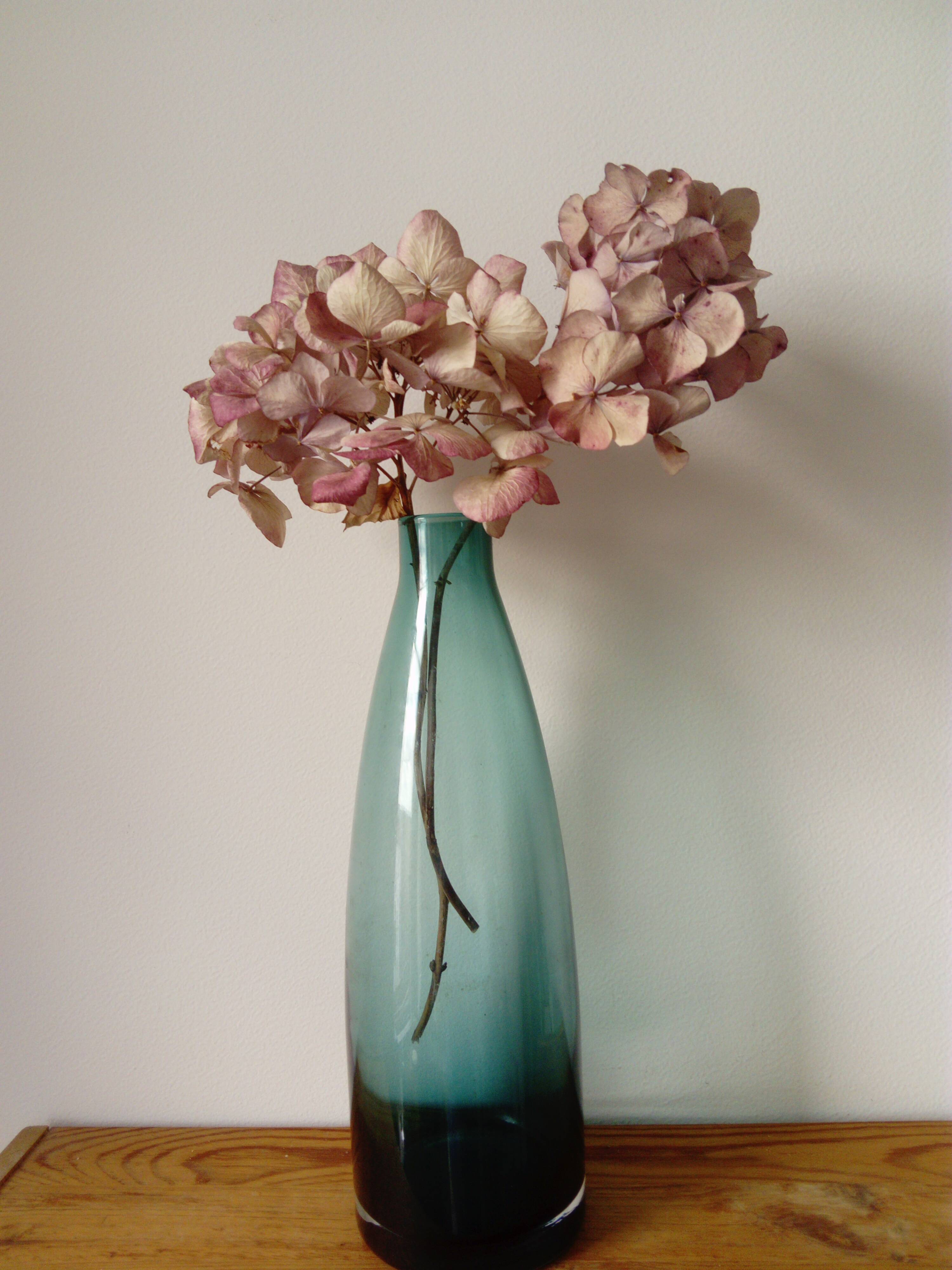 Designer vase in blue-green glass