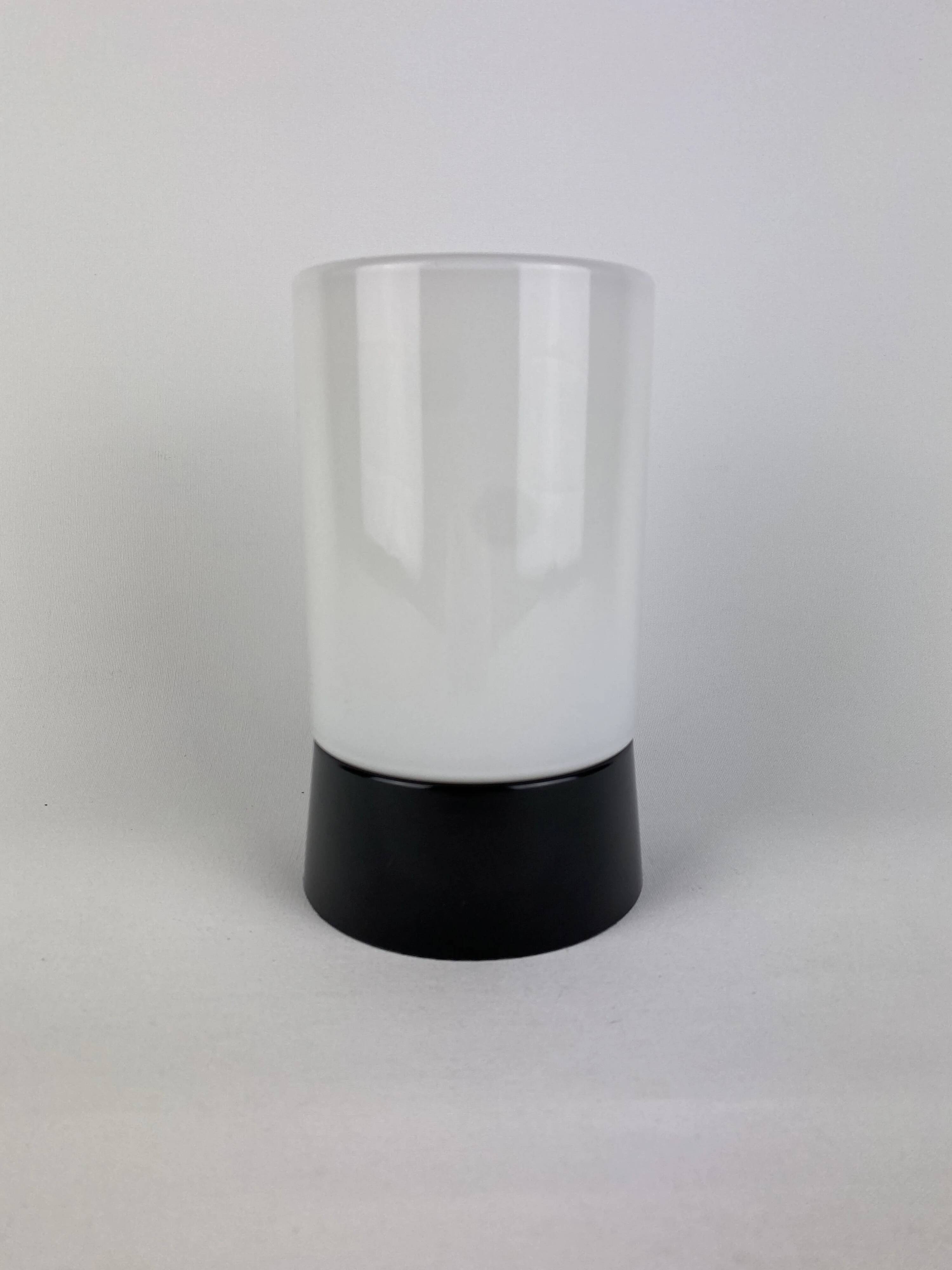White cylindrical Art Deco chandelier RAAK with black support.