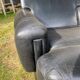 Pair of black imitation leather armchairs