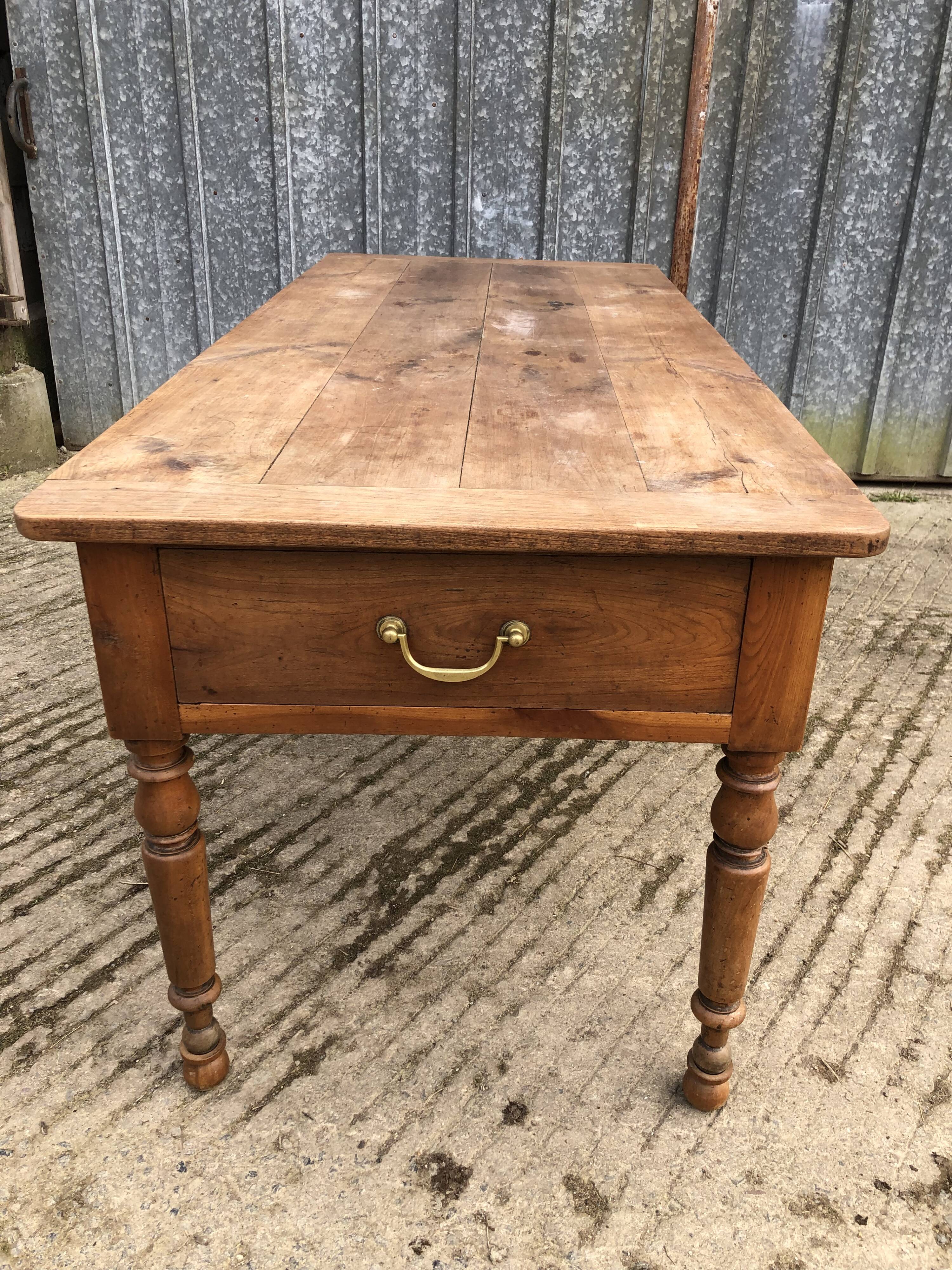 Antique cherry farmhouse table with 2 drawers and 1 pull-out