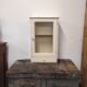 Wall-mounted cabinet with glazed pharmacy in vintage wood