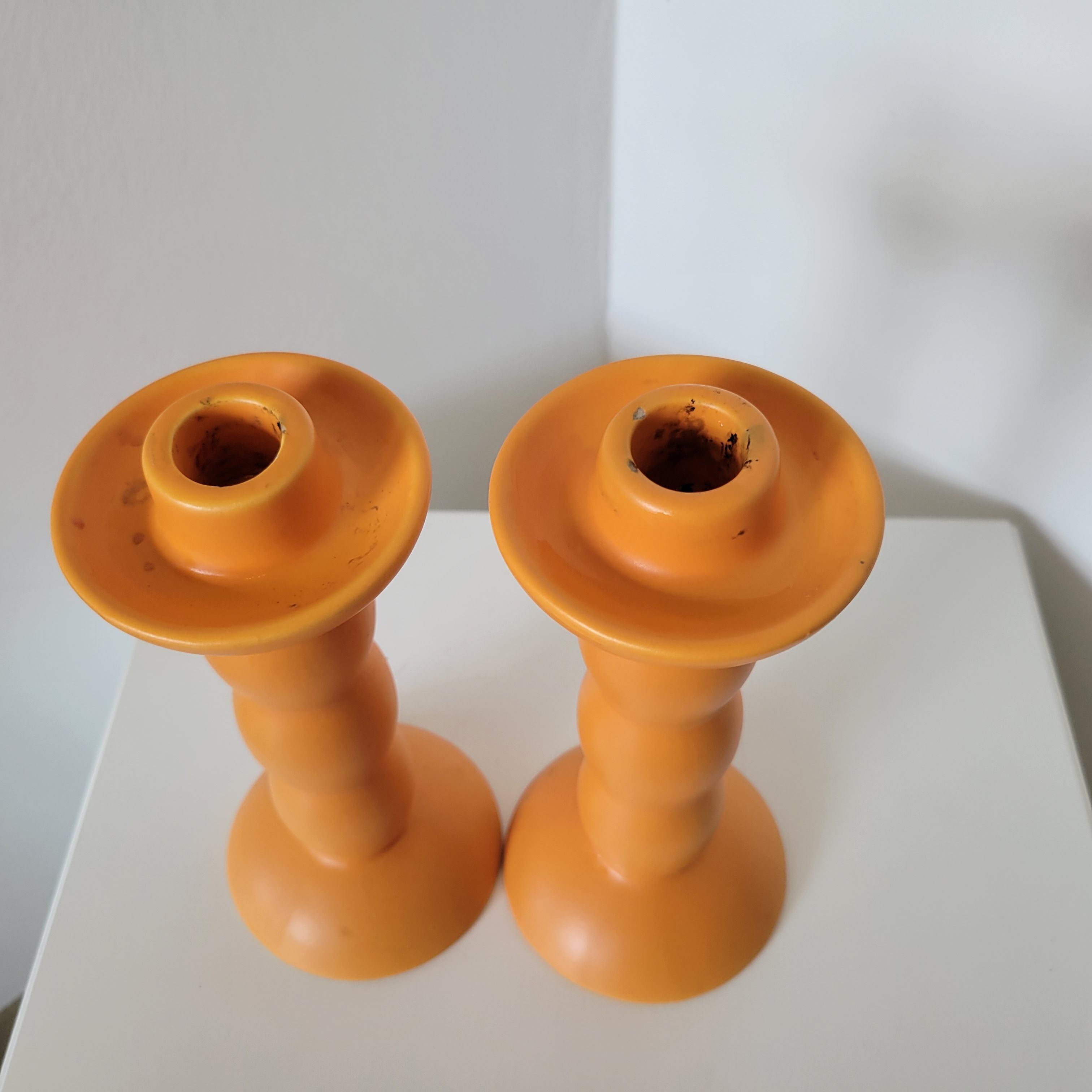 2 orange ceramic candle holders