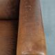 Large and comfortable sheepskin leather wingback chair with black piping