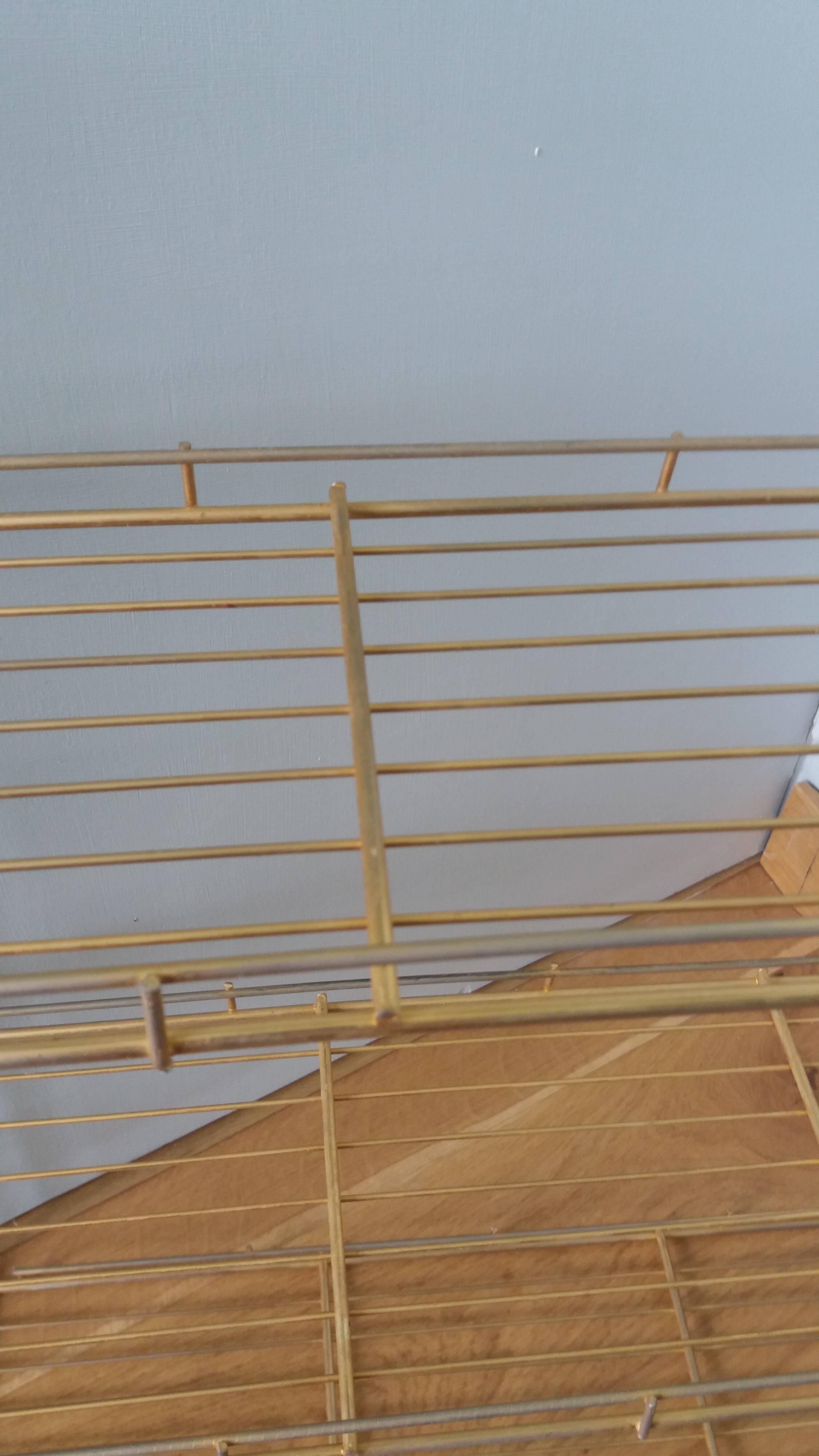 String shelf in golden metal wires