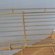 String shelf in golden metal wires
