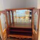 Showcase with shell mouldings in wood, glass, and mirror.