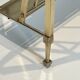 Neoclassical brass magazine rack attributed to Maison Ramsay.