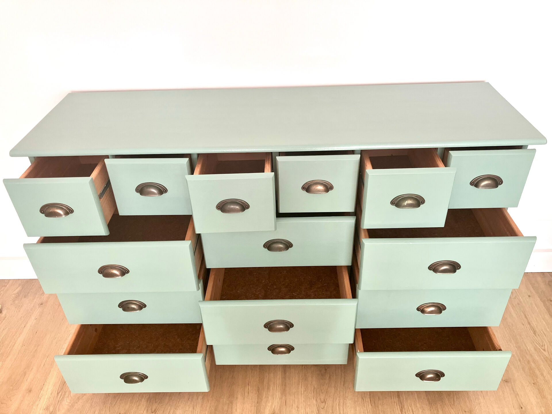 Low buffet with patinated gold handles.