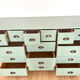 Low buffet with patinated gold handles.