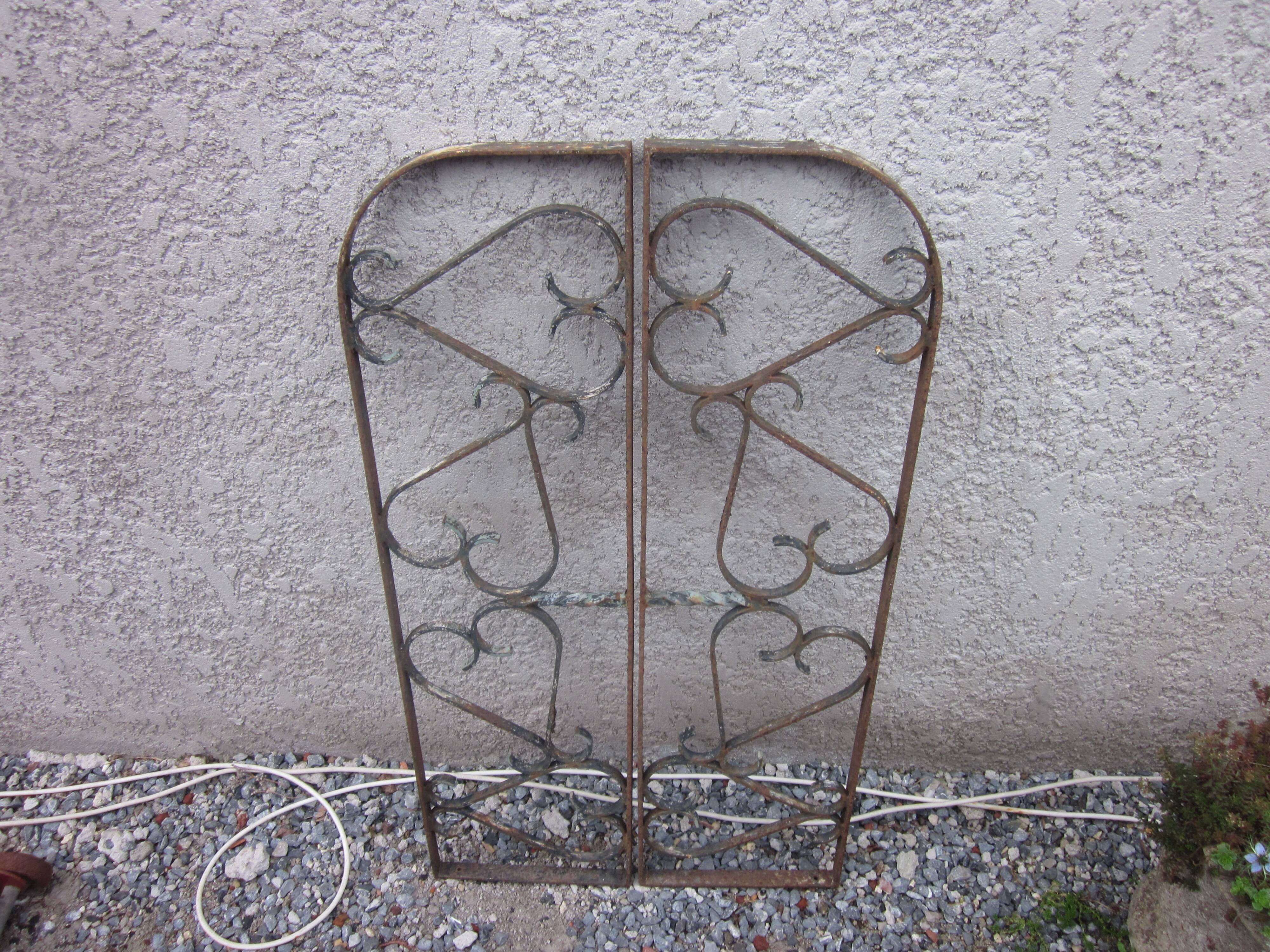 Pair of old wrought iron grid