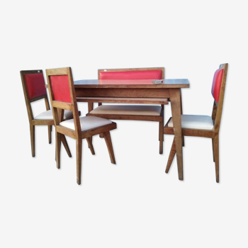 60 year table with 3 chairs and a bench