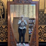 Art deco mirror in carved walnut