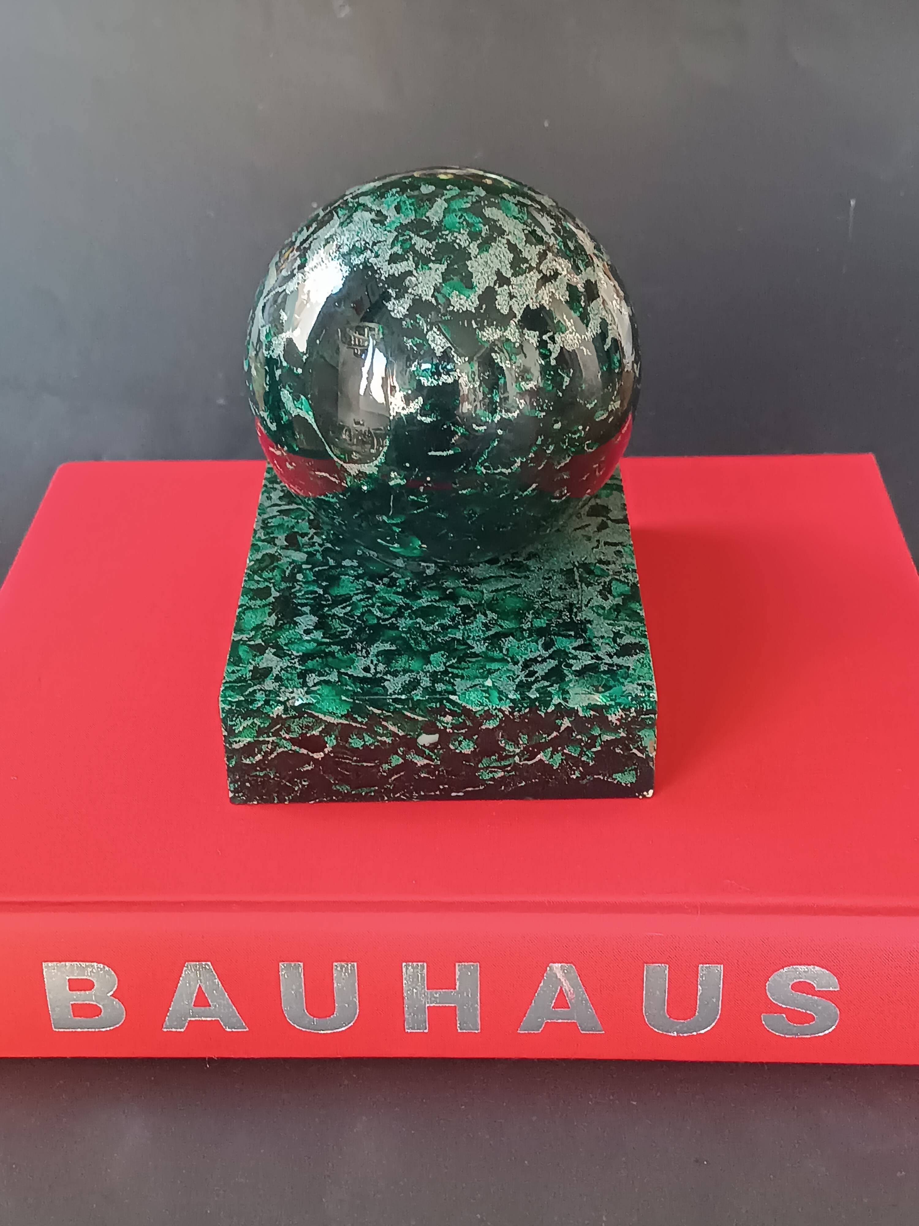 Design bookends in fractal resin with watchmaking inclusions.