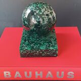 Design bookends in fractal resin with watchmaking inclusions.