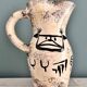 Enamelled ceramic pitcher with rock decoration