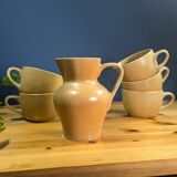 Jug and 5 cups in orange stoneware, very good condition, signed and numbered