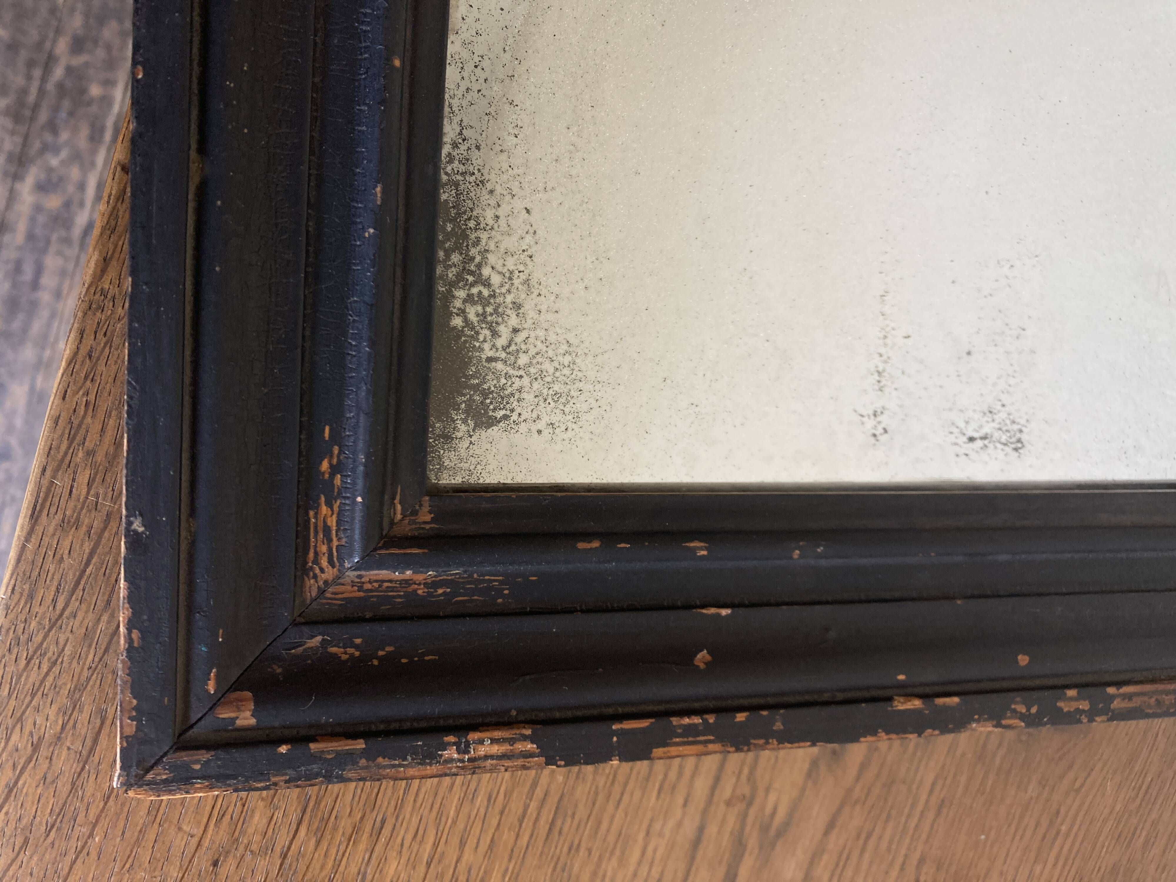 19th century blackened mirror with pitted glass 34cm x 40cm