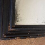 19th century blackened mirror with pitted glass 34cm x 40cm