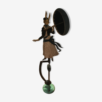 Woman with metal umbrella, pendulum